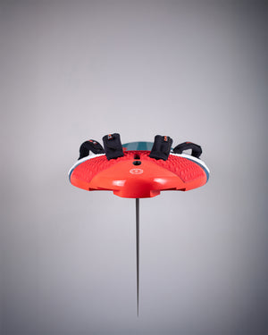 Red and white hummingbird feeder on Carve Windsurf Board