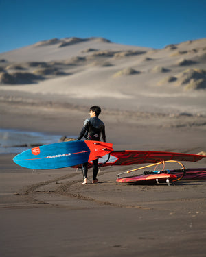 Ultra Windsurf Board: blue and white fiberglass surfboard with red fins