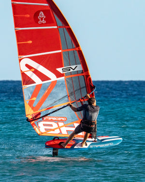 Red and orange X-15 windfoil board sail with black accents