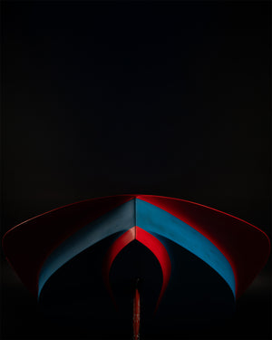 Red and blue X-15 Windfoil surfboard with pointed fiberglass tip