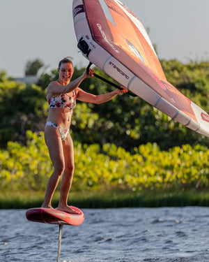 Orange and white Starboard Viva Wing windsurfing sail