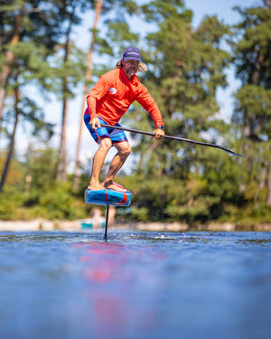 Ace Foil Lightning hydrofoil board with blue white design and black fins for downwind performance