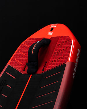 Red and black Strasser ignite wing foilboard with orange accents