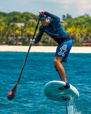 Take Off Foilboard: white hydrofoil with black paddle, red accents