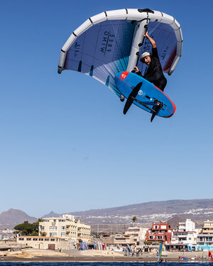 High-performance blue and white kiteboarding wing with red accents for 2025 Take Off Foilboard