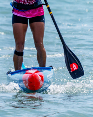 Transparent Lima Prepreg Carbon Paddle with red buoyancy aids and blue trim