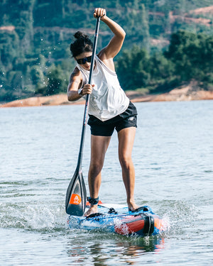 Inflatable stand-up paddleboard in orange and blue with Lima Prepreg Carbon Paddle