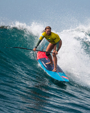 Blue and red Longboard SUP paddleboard with black leash for surfing