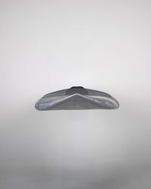 Silver metallic stealth bomber model airplane toy in Pro Paddleboard