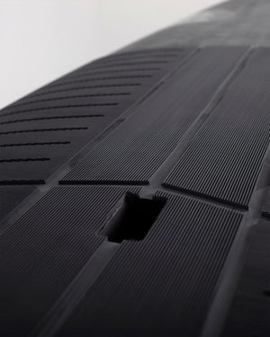 Pro Paddleboard black textured rubber mat with vent holes and cutout grip drainage