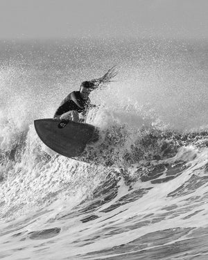 Black TwinFin Paddleboard with white wave design surfboard