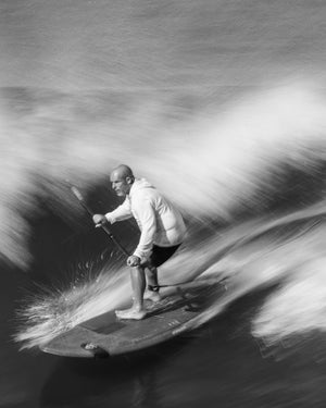 White jacket water skier on TwinFin Paddleboard