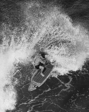 Classic red wooden TwinFin Paddleboard with sleek surf design