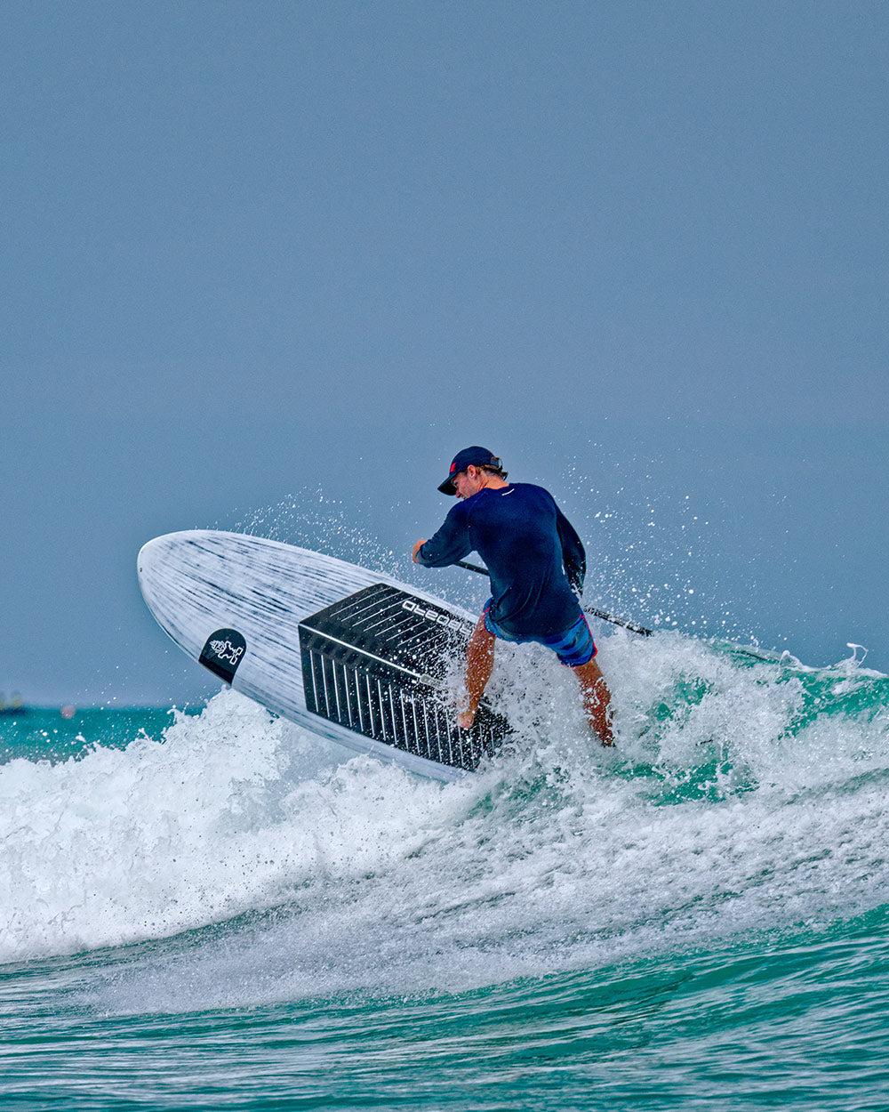 Sleek white Wedge Paddleboard with black accents and durable polyethylene