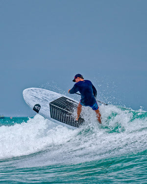 Sleek white Wedge Paddleboard with black accents and durable polyethylene