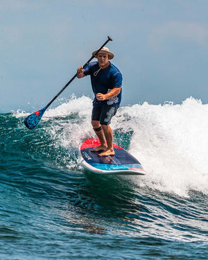 2025 Whopper Paddleboard: Blue and red SUP with black fins for surfing