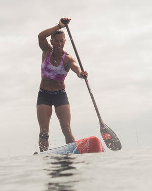 Red and white Velocity Paddle Prepreg Carbon board with black oar