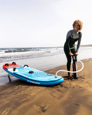 Blue inflatable windsurf board with red fins and black leash