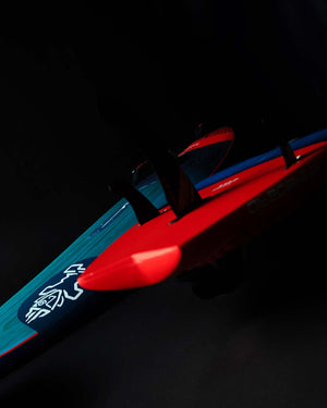 Red and blue toy submarine with white logo on 2025 Kode Windsurf Board