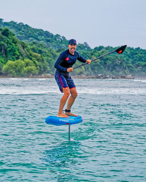 Ace Air Foil inflatable hydrofoil board with black paddle and red accents