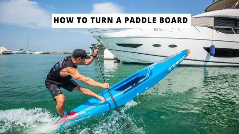 Blue kayak with white text and black accents for paddle boarding techniques