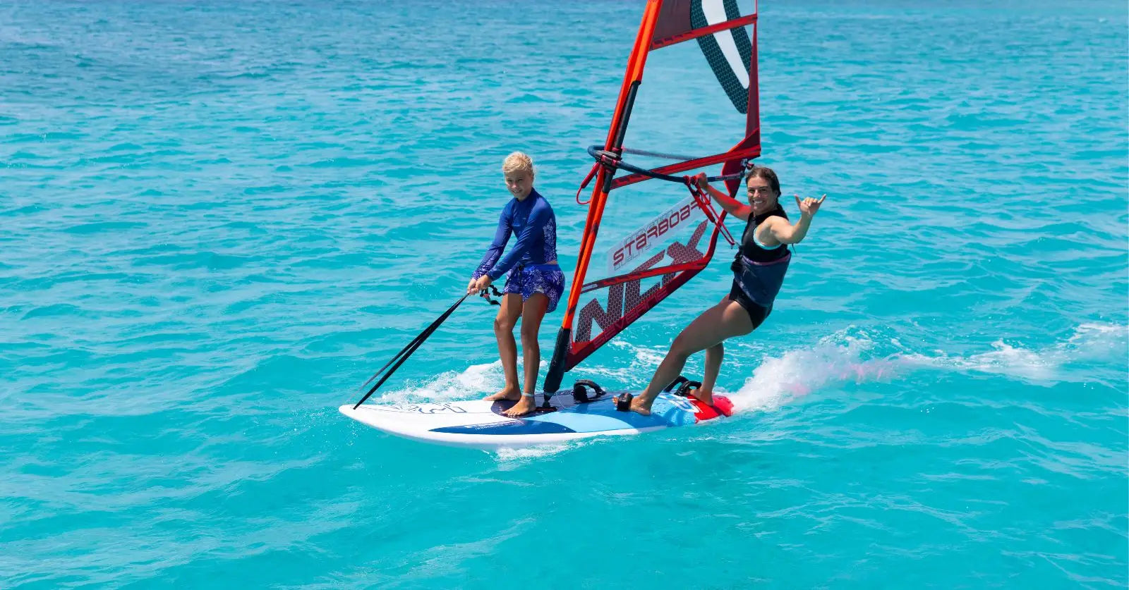 Red and white GO Windsurfer board with blue accents for recreational use
