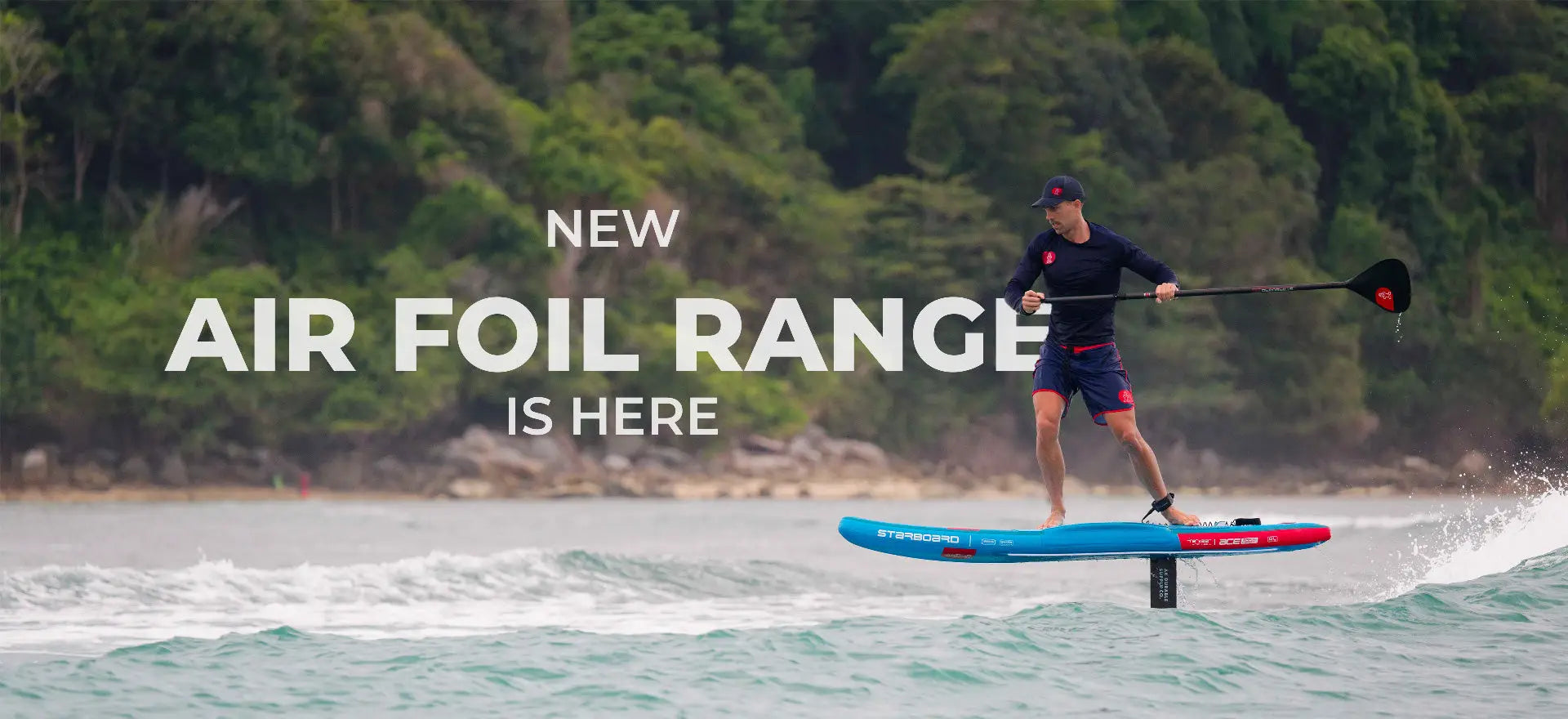 Starboards red and blue inflatable hydrofoil board with black fins.