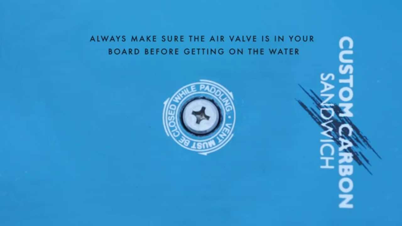 Custom carbon sandwich board with blue background and white text for Starboard Race Board air valve