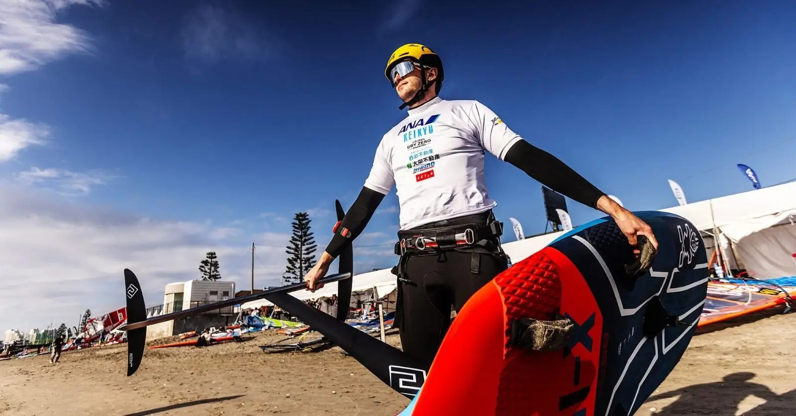 Starboard Fabian Wolf windsurfing board in red, navy, with x logo