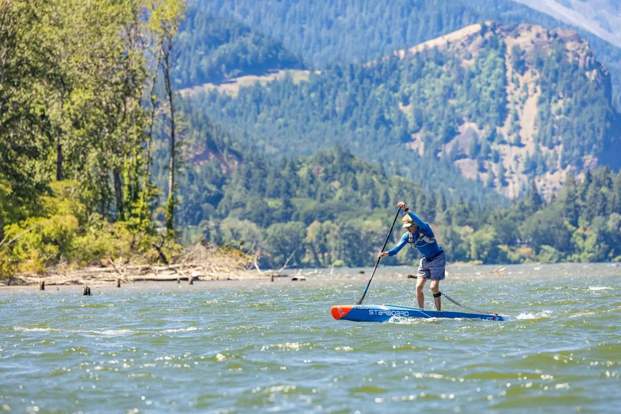 Blue and white paddleboard with black leash in Connor’s 2023 Gorge win