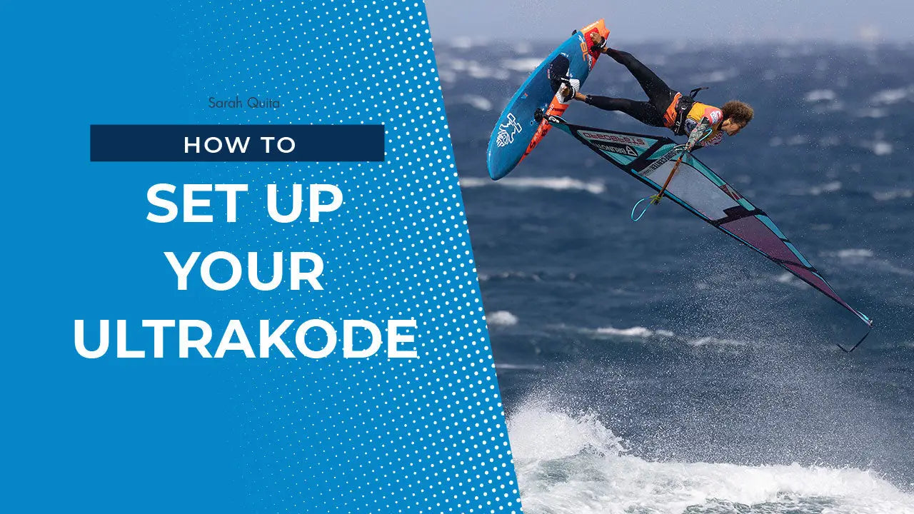 Ultrakode sailboard with blue orange accents and carbon fiber design