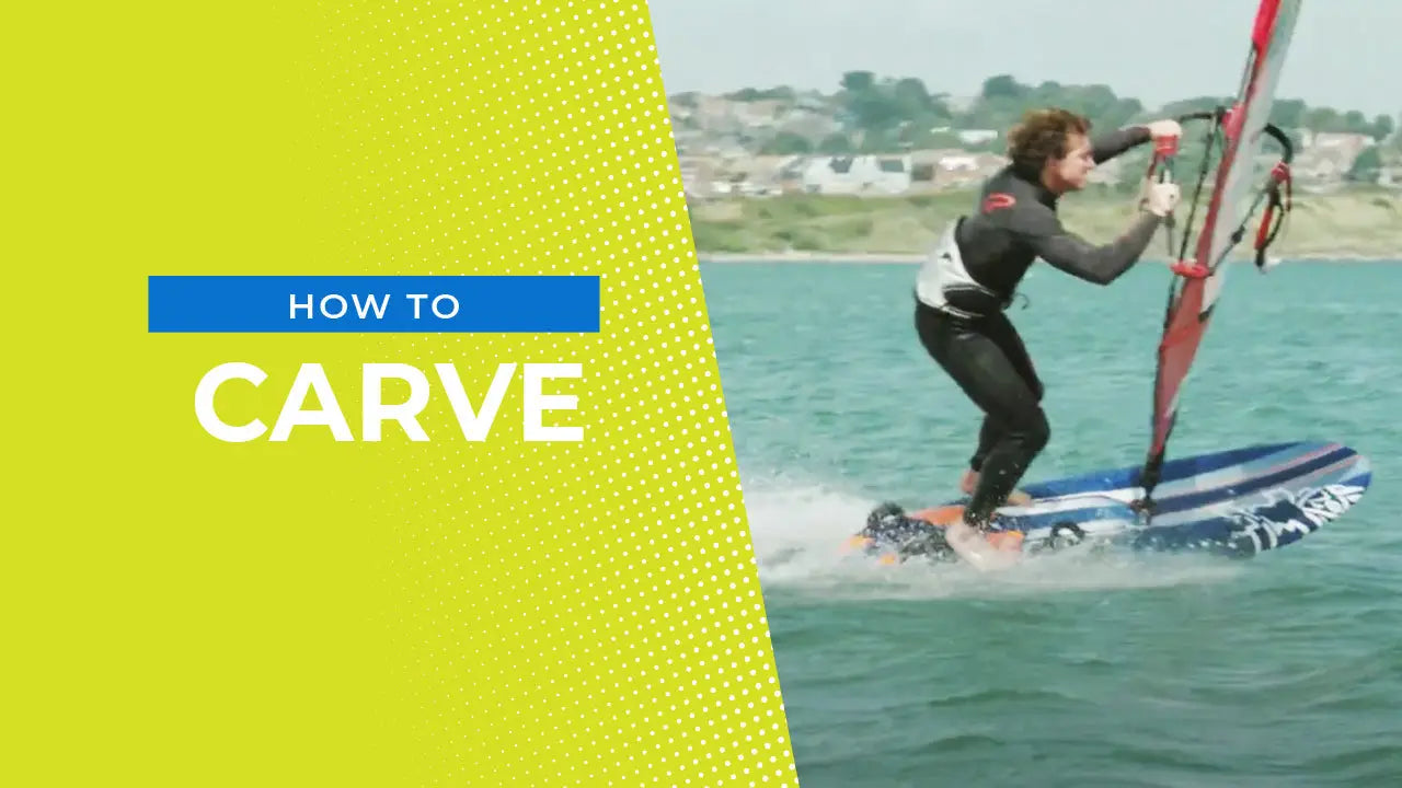 Windsurfing board with blue white design black leash red sail carving tips