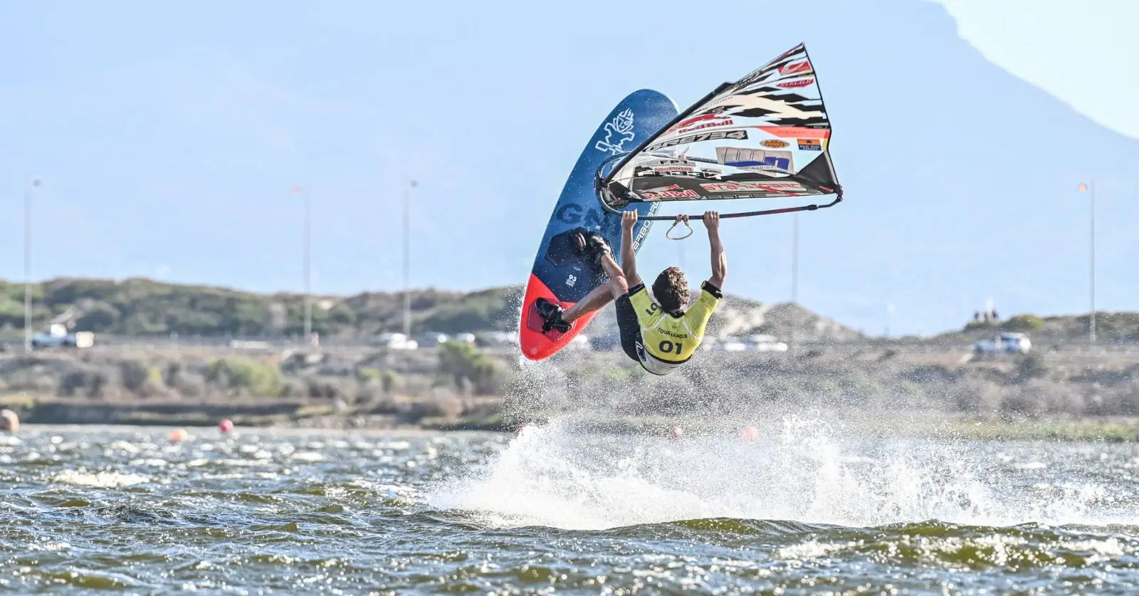 Lennart’s red black windsurfing board with blue sail, second at FPT Cape Town