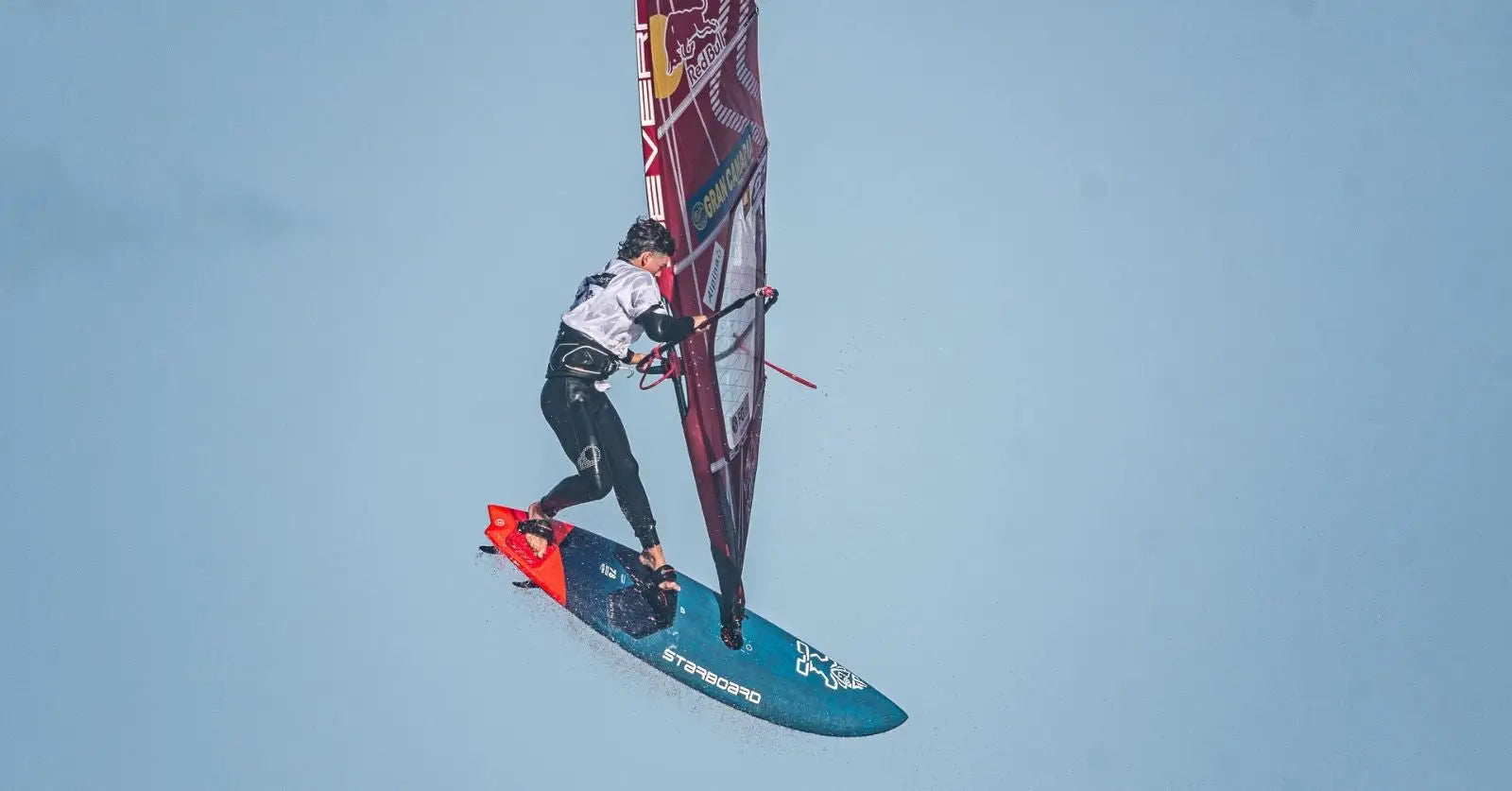 Liam Dunkerbeck’s Starboard windsurfing board with teal black design and red fins