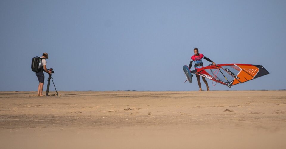 Orange black kiteboarding sail with red accents by Maarten Molenaar