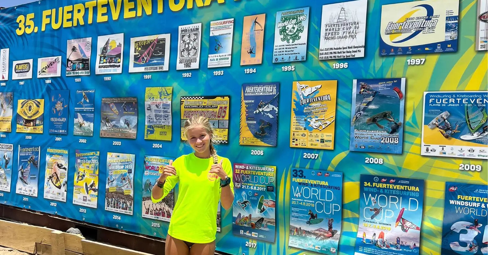 Neon yellow athletic tank top with black trim and white logo on Bobbi-Lynn