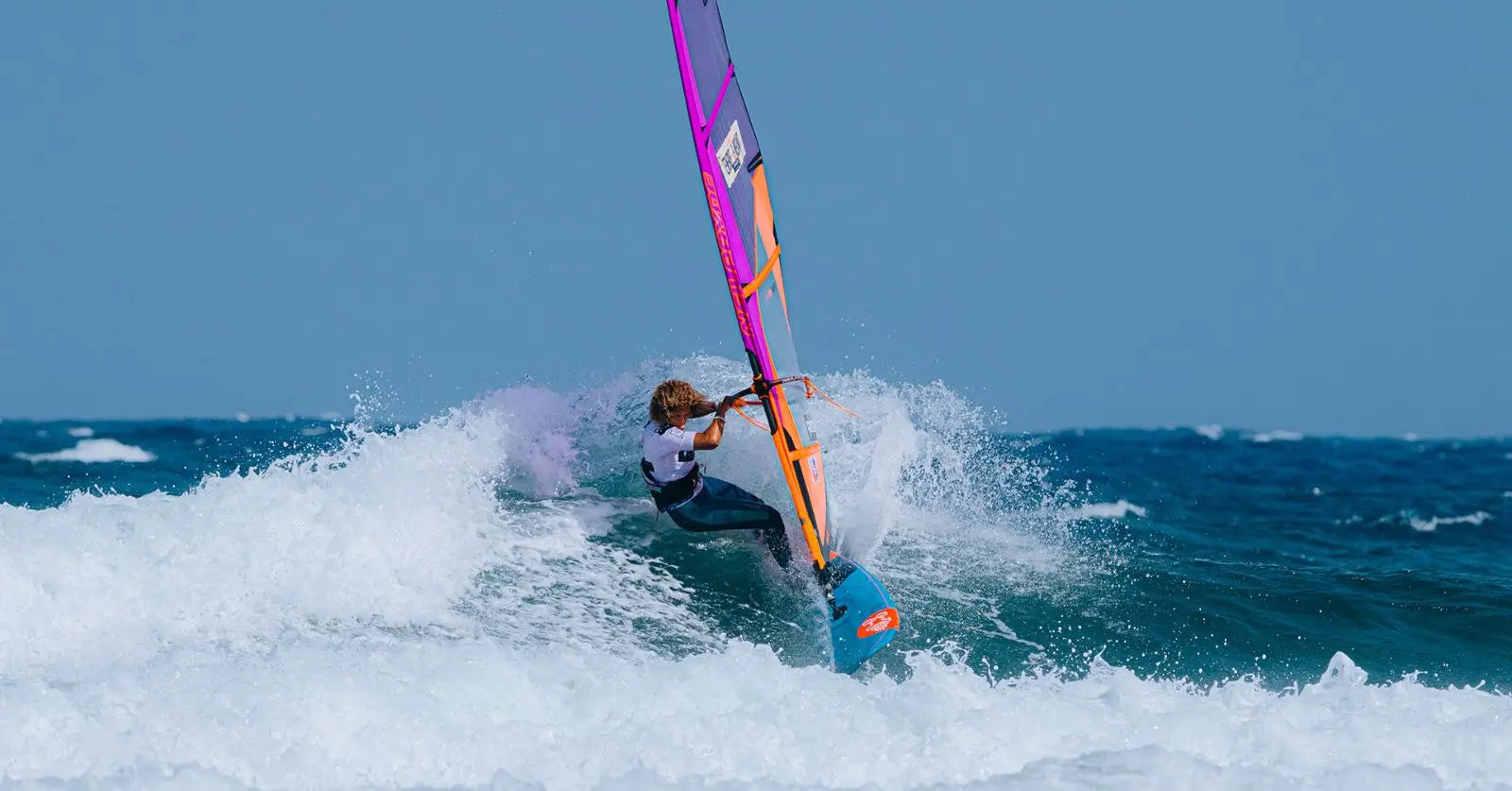 Purple pink windsurfing sail with blue accents, durable nylon, Sarah-Quita Tenerife win