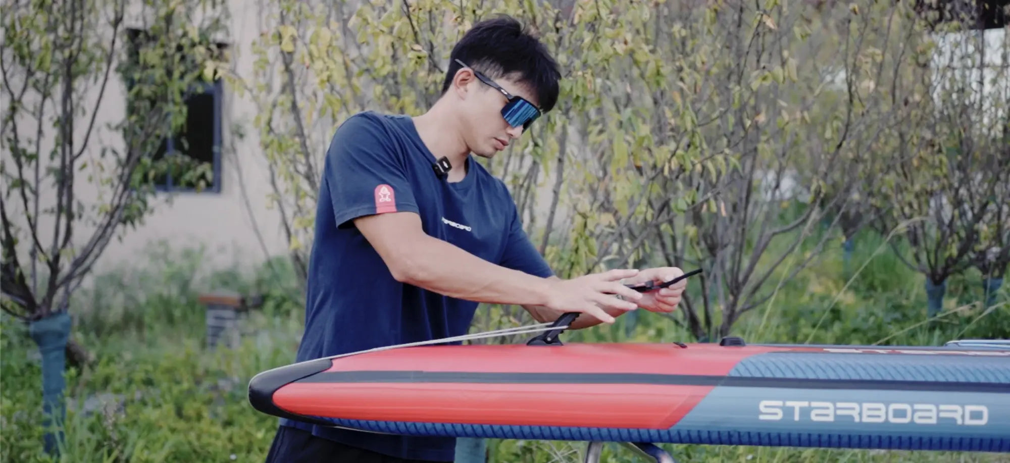 Red and blue Starboard inflatable paddleboard with Airline iSUP branding