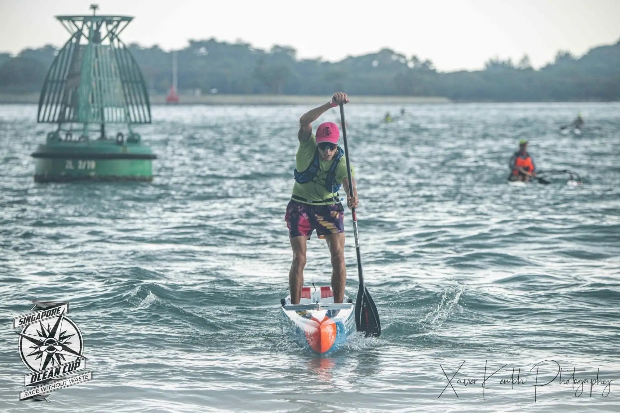Orange and white stand-up paddleboard with black ankle leash at Singapore Ocean Cup 2023