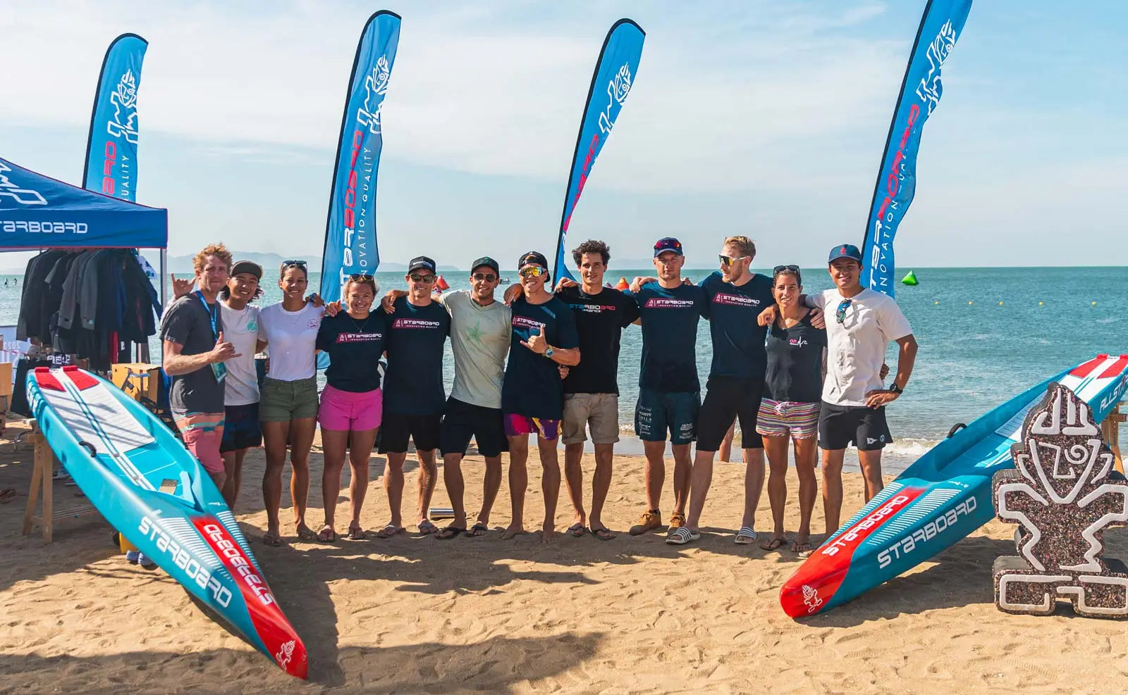 Starboard 2024 Dream Team blue and white fiberglass surfboard with red accents