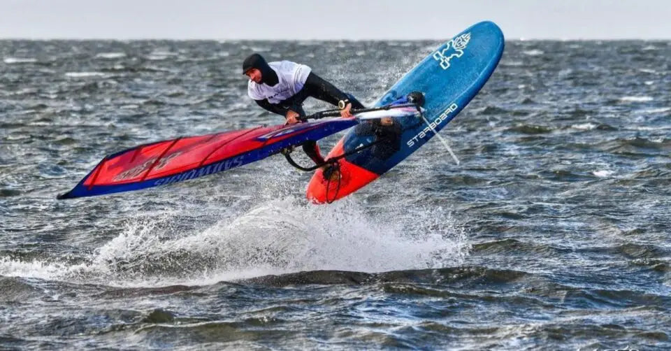 Starboard windsurfing board with blue-red design at OBX-WIND 2023
