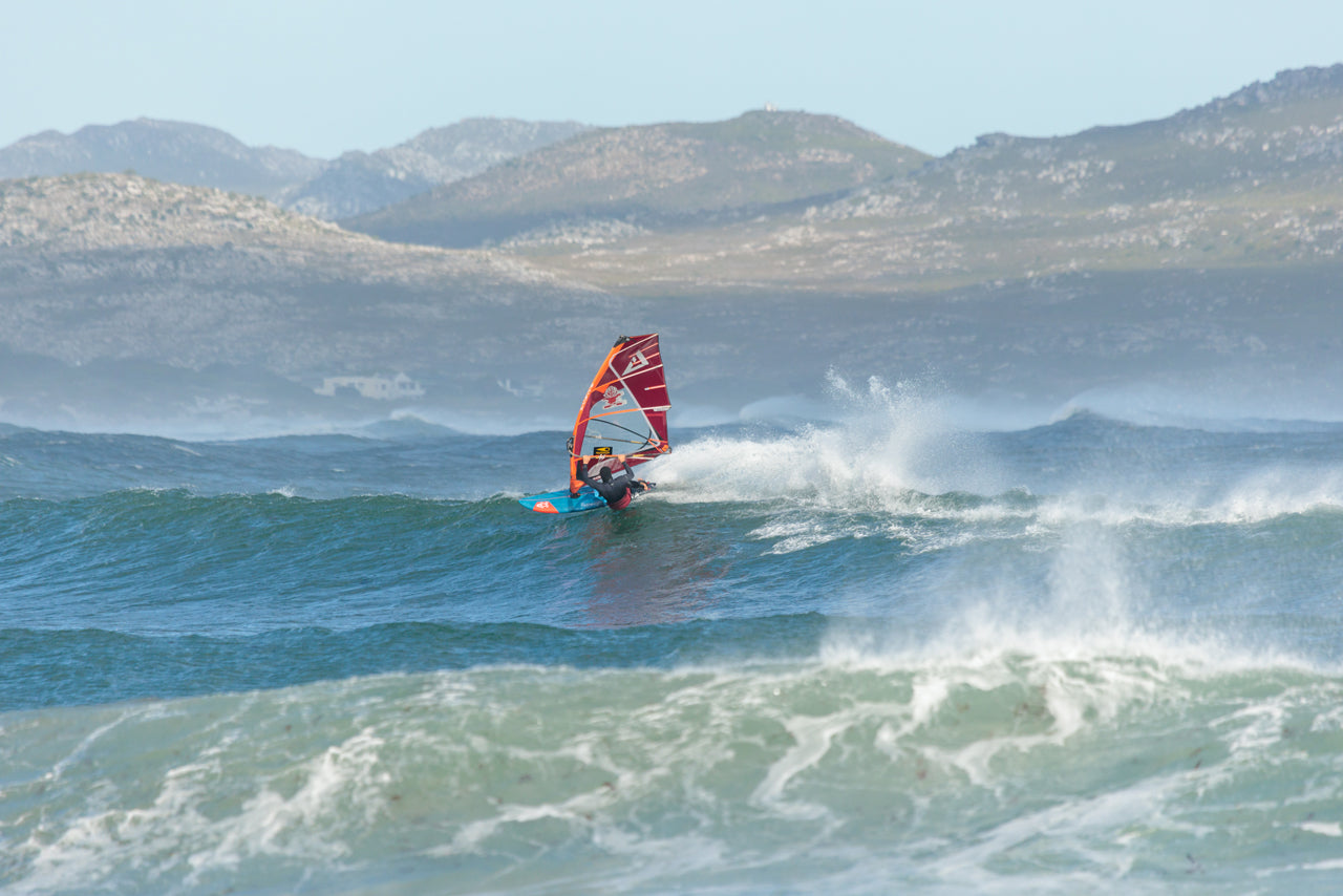 Sleek blue and red windsurf board in Windsurf Boards collection