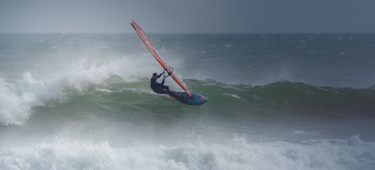 Sleek blue and red windsurf board in Windsurf Boards collection