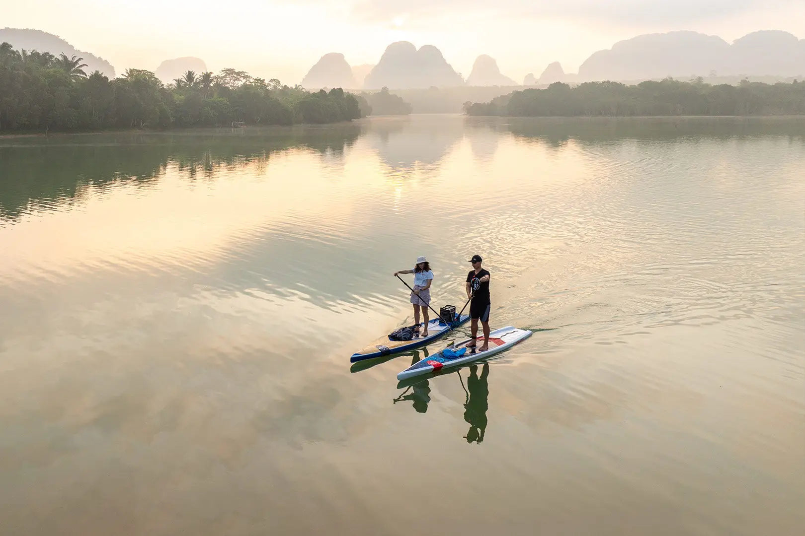Vibrant orange adventure paddleboard in sleek polyethylene design