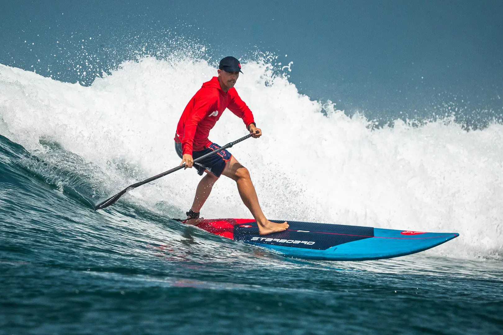 Blue and black SUP paddle with red accents for all-round wave surfing