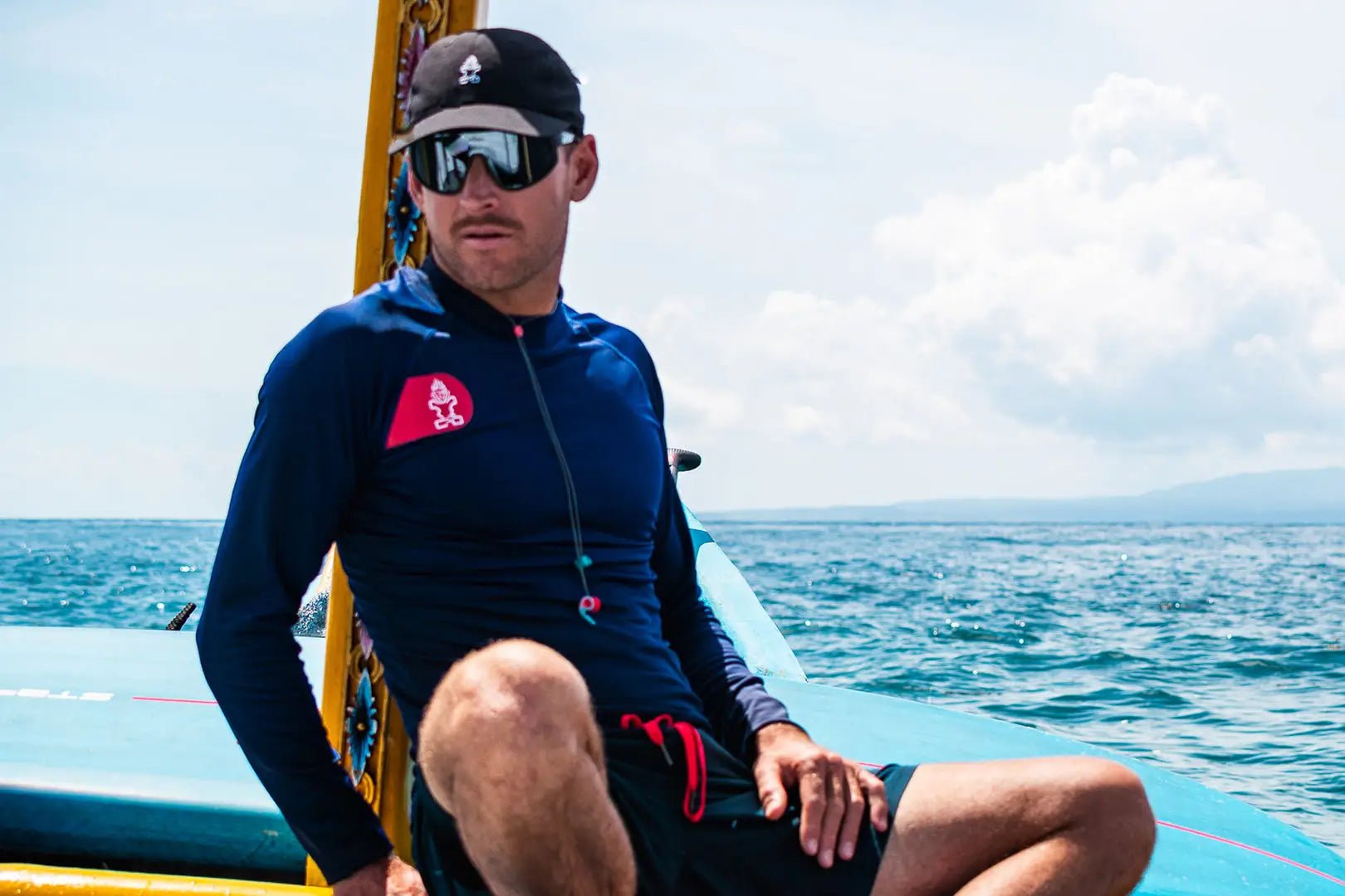 Mens blue and black wetsuit with red zipper for water sports