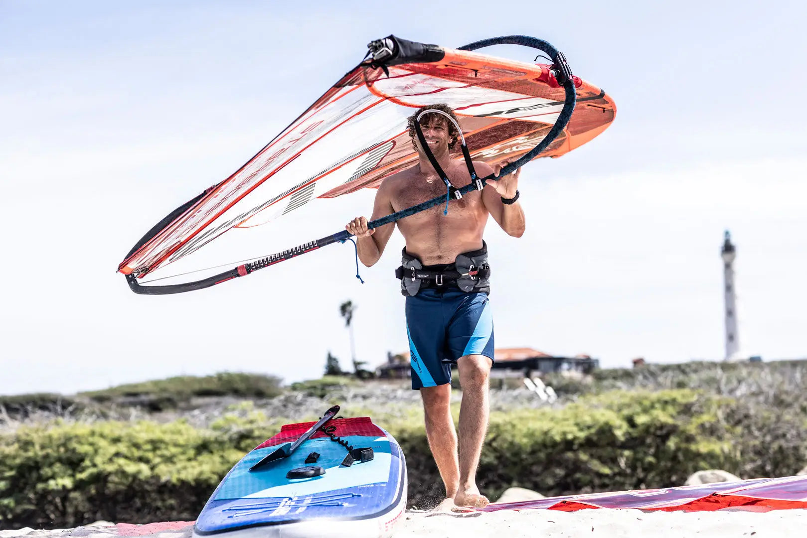 Orange windsurfing sail with black trim and nylon fabric for men