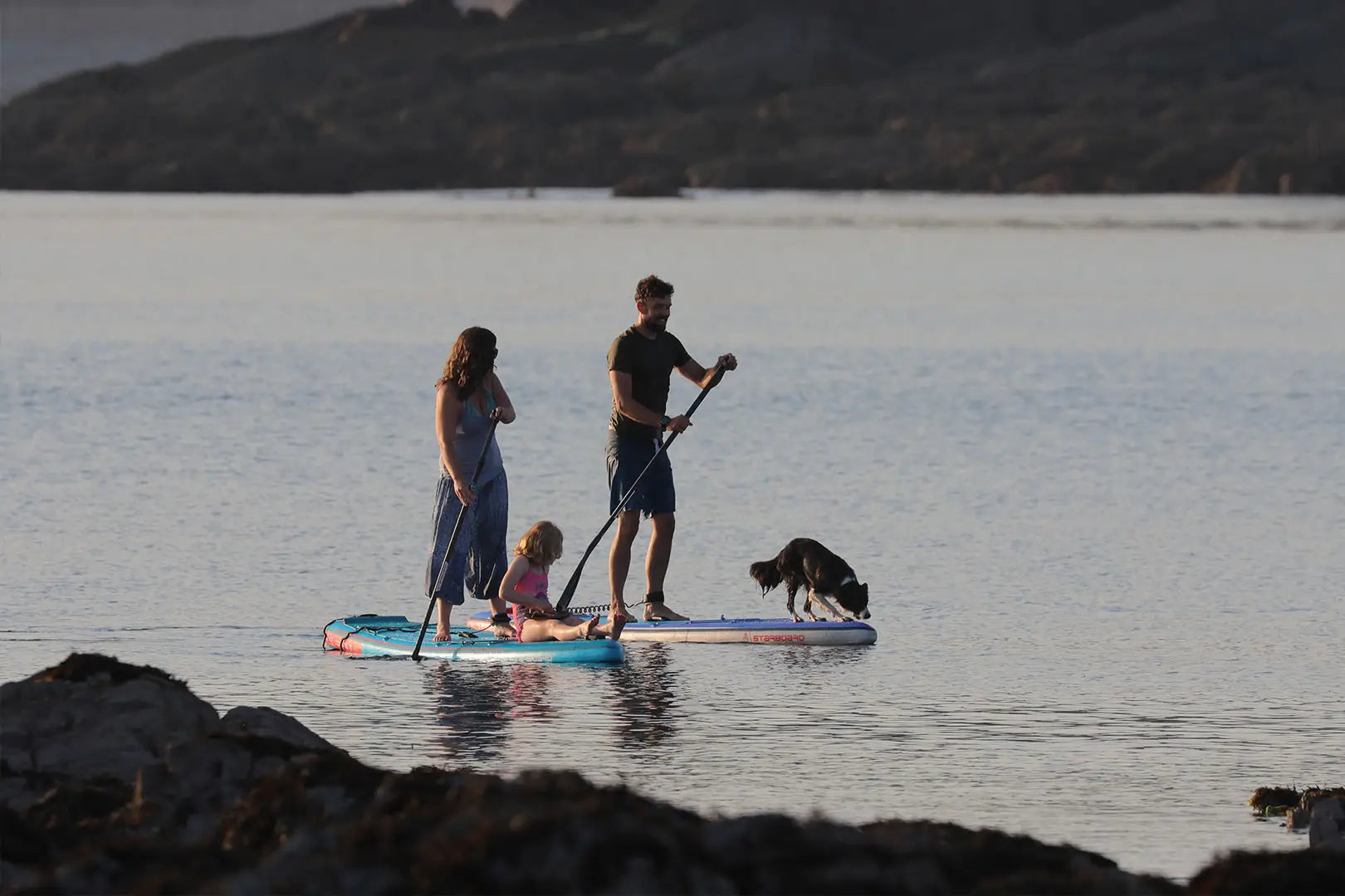 Entry-level inflatable foam paddleboard in blue and white