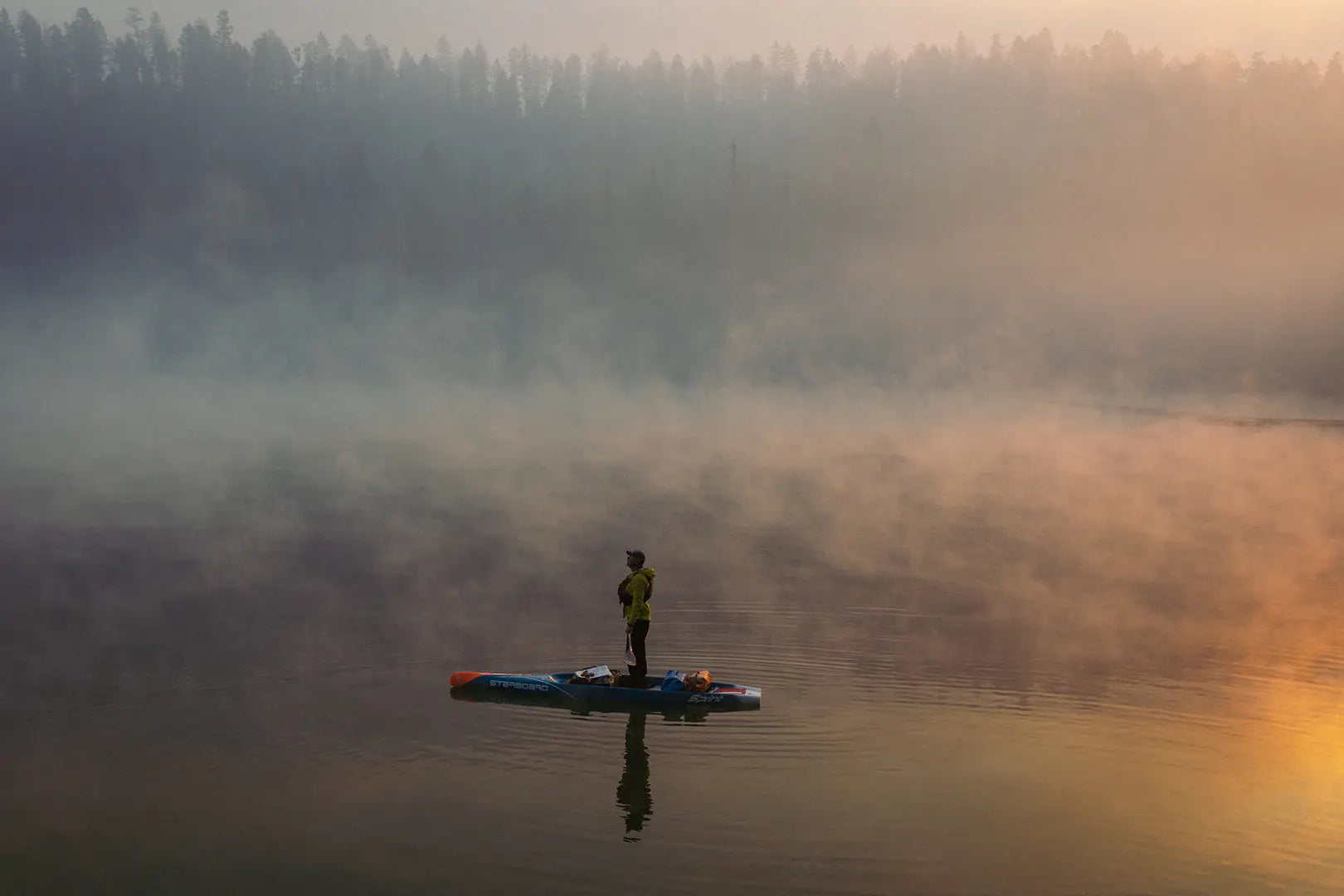 Yellow inflatable kayak with red and blue accents in Expedition Paddleboards