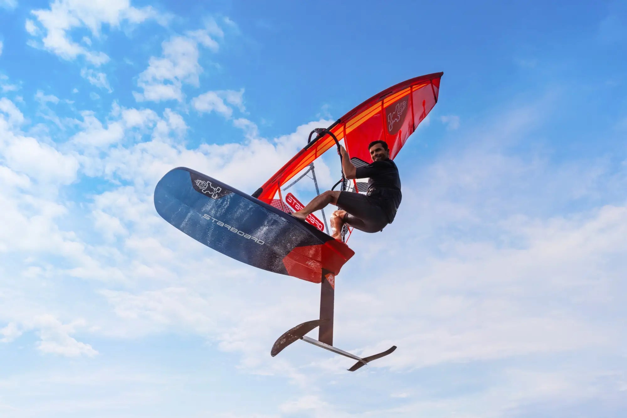 Red and black Foil FreeRide windfoil board with sail